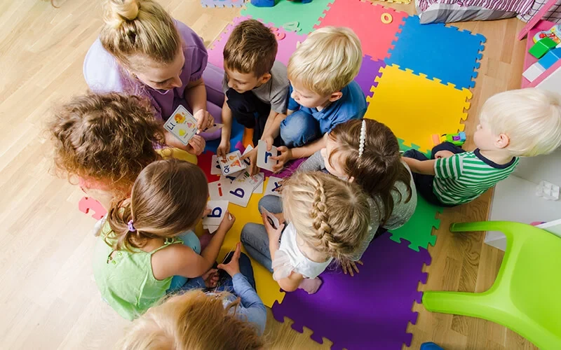 Children practicing classroom and peer interaction skills